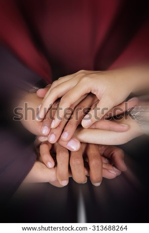 Business teamwork concept. Close up zoom on a pile of businesspeople hands