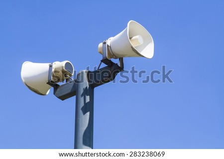 Speaker in public on blue sky