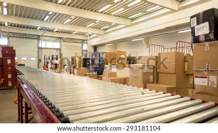 Package boxes of different sizes waiting to be delivered are seen next to conveyor belt in the DHL storehouse in Sofia, Bulgaria, October 7, 2014.
