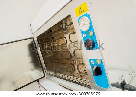 Thermoventilated autoclave sterilizer equipment in a medical cabinet.