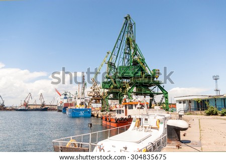 Giant port cranes during operations for loading and unloading cargo at Varna port, Varna, Bulgaria, May 16, 2014.