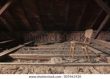 Old chair is seen at the ceiling of an old school building Sofia, Bulgaria, May 12, 2014. Some of the doors and windows had been wrecked. Thick layer of dust is all over the place.