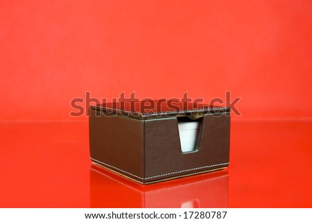 A note block isolated against a red background