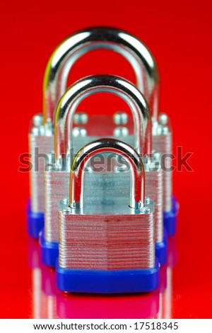 Padlocks isolated against a red background