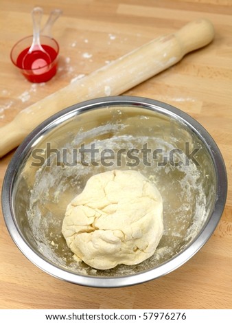 Scone dough bsing prepared on a kitchen bench