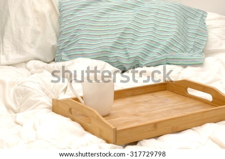 A photo of a breakfast tray in bed