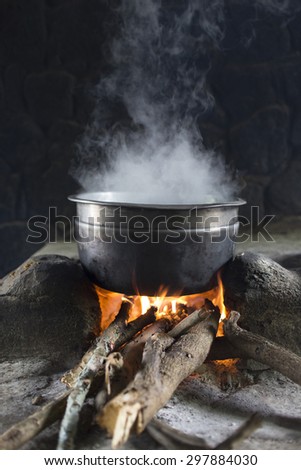 Cooking over open fire at campsite