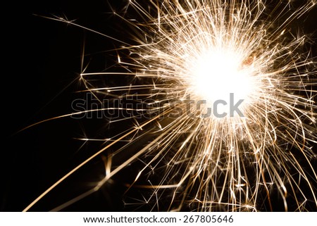 an isolated spark from a sparkler