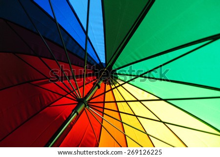 A rainbow multicolored umbrella fragment