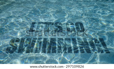 Let\'s go swimming text appearing under water in a swimming pool.