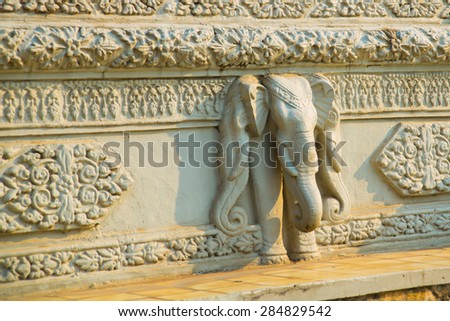 A fragment of an ornament with an elephant .A fragment of an ornament with an Cambodia.The Royal palace in  Phnom Penh.