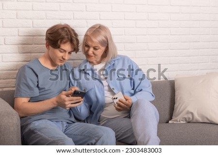 Image, Stock Photo Parents sitting with their son enjoying the time together at home