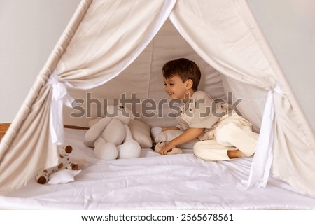 Similar – Image, Stock Photo Little caucasian boy enjoying sun and wind travelling in a car with open window.