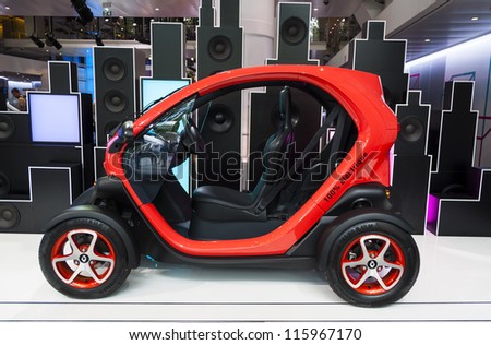 PARIS - JUNE 23: The new electric car Renault Twizy on display at l\'Atelier Renault on the Champs-Elysees on June 23, 2012 in Paris, France. The Renault Twizy is a full electric two-seater car.