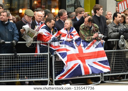 LONDON - UK, APRIL 17: The crowd waits for Baroness Thatcher funeral procession on Ludgate Hill, on April 17, 2013 in London.