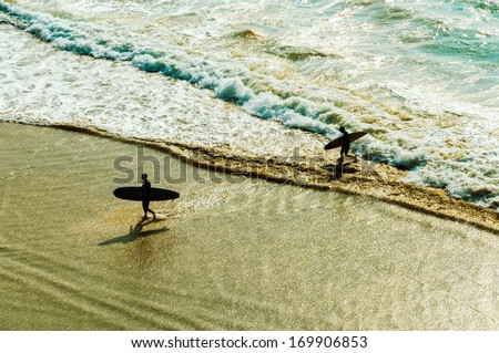 Similar – Image, Stock Photo Surfer at the beach carrying surfboard