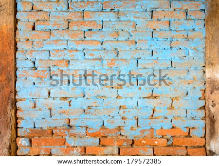 Blue painted brick wall texture, timbers on both sides
