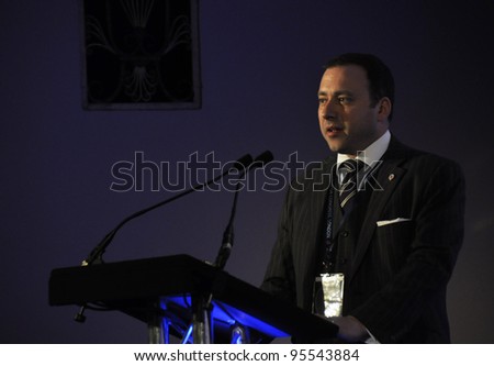 LONDON - JANUARY 30: Speaker on the stage during the 59th UICH les Clefs d\'Or International Congress at the Sheraton Park Lane on January 30, 2012 in London