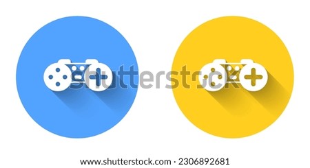 White Gamepad icon isolated with long shadow background. Game controller. Circle button. Vector
