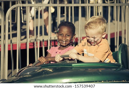 Kids on an amusement park ride