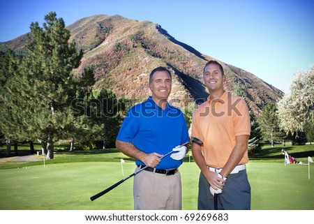 Portrait of two male golfers on the golf course