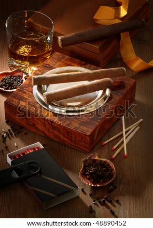 still life with drink and cigars