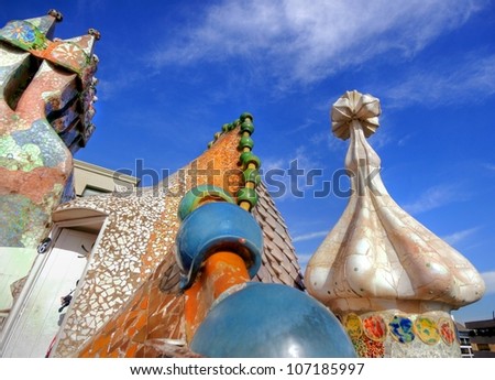 BARCELONA - FEBRUARY 18: The famous architect GaudiÃ?Â­ treated rooftop chimneys like pieces of art on the rooftop of the house Casa Batllo on February 18, 2011 in Barcelona, Spain.