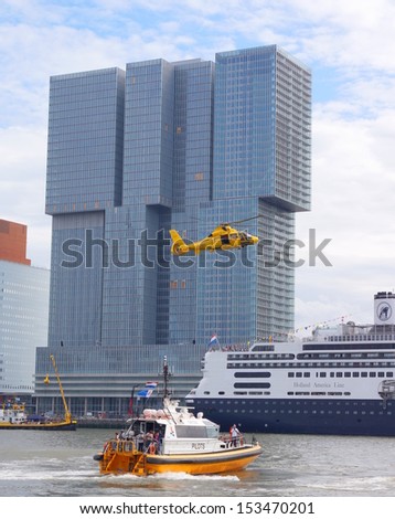 ROTTERDAM - SEPTEMBER 7, 2013: The World Port Days at the port of Rotterdam  on September 7 , 2013 in Rotterdam,The marine is showing how to resque people from a boat by helicopter from the water