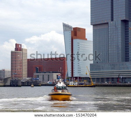 ROTTERDAM - SEPTEMBER 7, 2013: The World Port Days at the port of Rotterdam  on September 7 , 2013 in Rotterdam, Netherlands. Showing many boats on the Maasriver and around the famous Erasmus bridge.