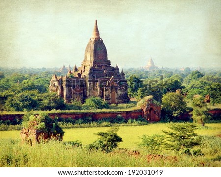 grungy style photo from a view at the valley of Bagan with his ancient pagoda\'s , Myanmar