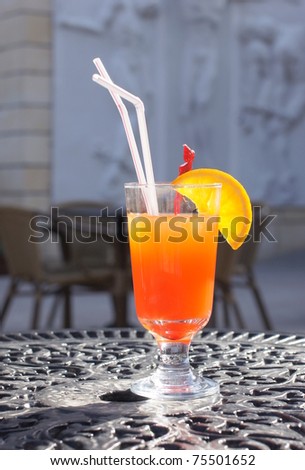 Tequila Sunrise cocktail on a terrace
