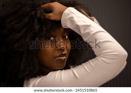 Similar – Image, Stock Photo Intimate portrait of afro latina with shadows in face