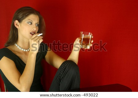 Woman having a drink and a smoke. (No Smoke)