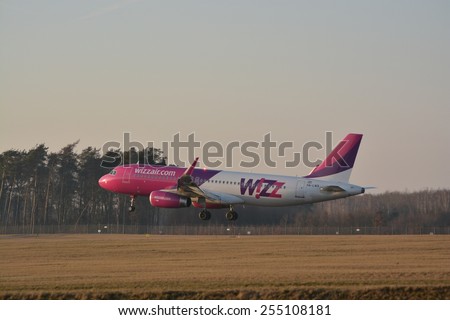 This is a view of Wizzair plane Airbus A320 registered as HA-LWX landing on the Lublin Airport. February 20, 2015. Lublin Airport in Swidnik, Poland