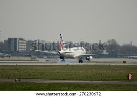 This is a view of Air France Airbus A318 registered as F-GUGR landing on Warsaw Chopin Airport. April 11, 2015. Warsaw, Poland.