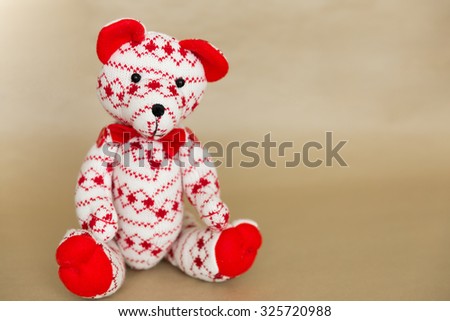 Holiday Christmas plush teddy bear on neutral background
