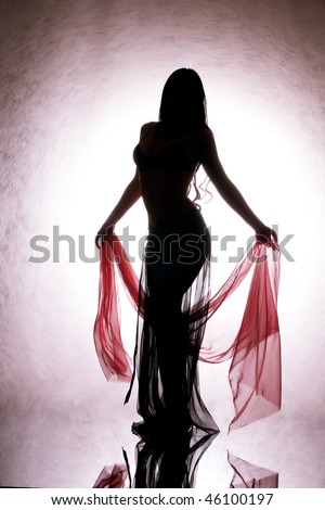 A silhouette of a dancing woman with a red silk in your hand.
