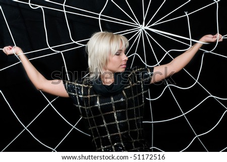 Woman caught in the web. Web as a symbol - of fraud, bad habits, negative relationships.