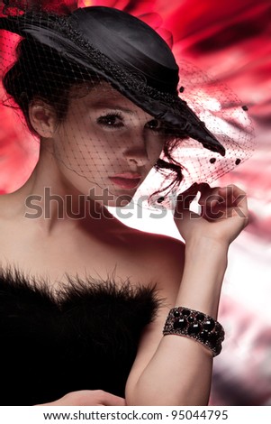 beautiful woman in a black hat with a veil
