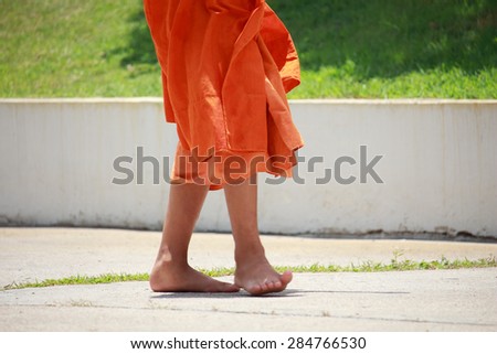 monks stand in line to get offerings