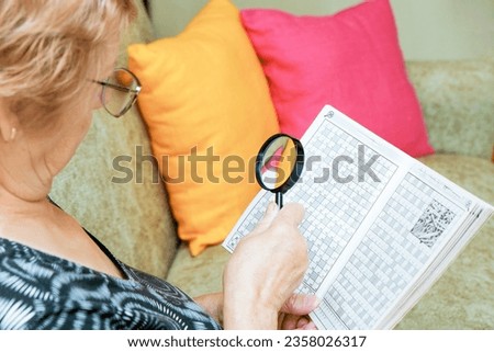 Similar – Image, Stock Photo Senior woman with magnifying glass