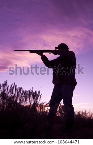 Hunter With Shotgun in Sunset