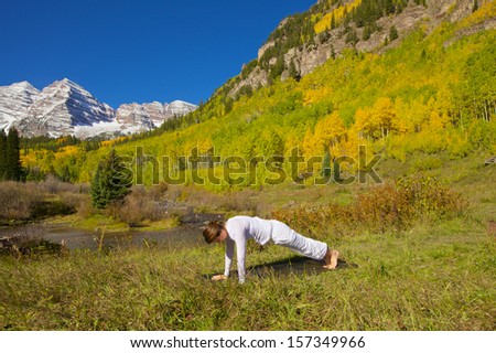 Woman Practicing Yoga at Maroon Bells in Fall