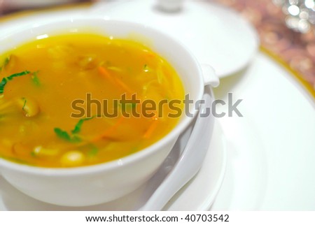 Sumptuous and healthy-looking Asian style vegetarian cuisine. Delicious shark\'s fin soup cooked with various vegetables, pumpkin, mushrooms, corn and mock meat.