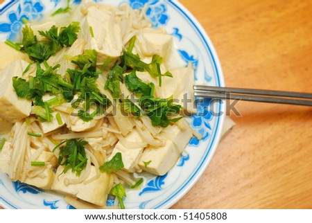 Chinese vegetarian bean curd cuisine. Ingredients include bean curd and mushrooms. Suitable for food and beverage, healthy eating and lifestyle, and diet and nutrition.
