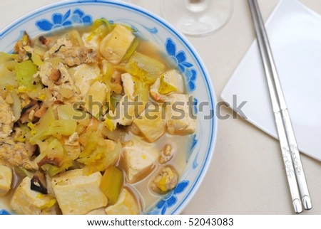 Chinese vegetarian bean curd cuisine. Ingredients include bean curd and mushrooms. Suitable for food and beverage, healthy eating and lifestyle, and diet and nutrition.