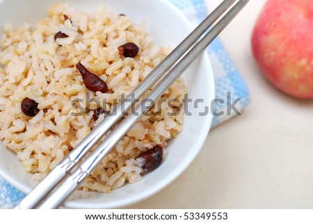 Cooked, red unpolished rice commonly eaten in Asian countries such as Japan and China. For diet and nutrition, healthy eating and lifestyle concepts.