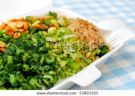 Takeout packed meal with variety of healthy green vegetables. Suitable for concepts such as diet and nutrition, healthy lifestyle, and food and beverage.