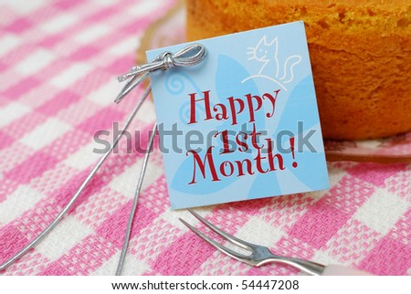 Small card beside cake for happy occasions. Suitable for celebration, festivals, and food and beverage concepts.