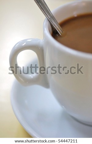 Coffee beverage in white cup and saucer. For food and beverage, and diet and nutrition concepts.
